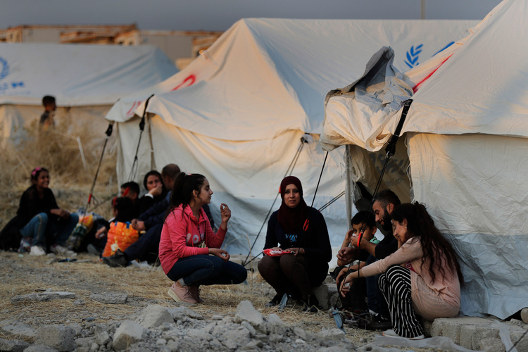 Сирийские курды в иракском лагере беженцев после начала операции «Источник мира». Фото: Hussein Malla/AP/TASS
